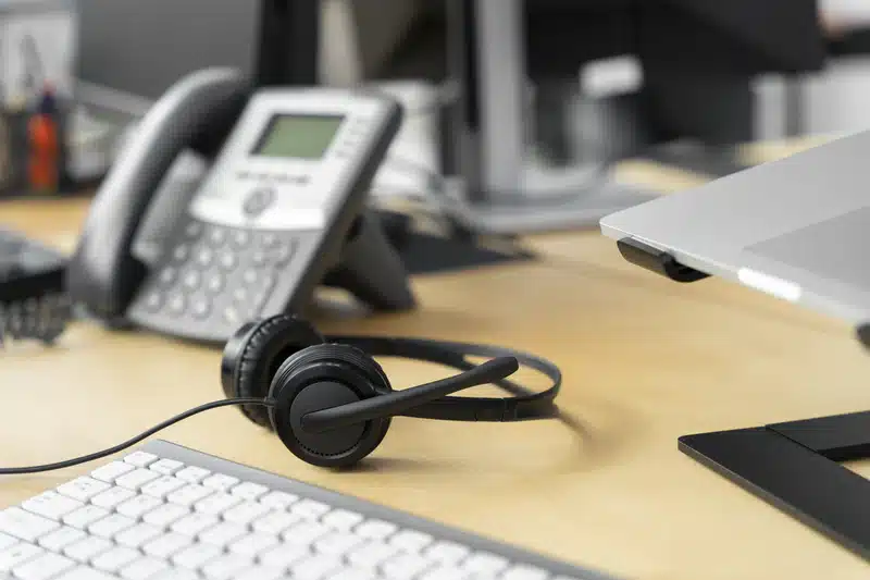 addiction hotline desk with telephone and headset