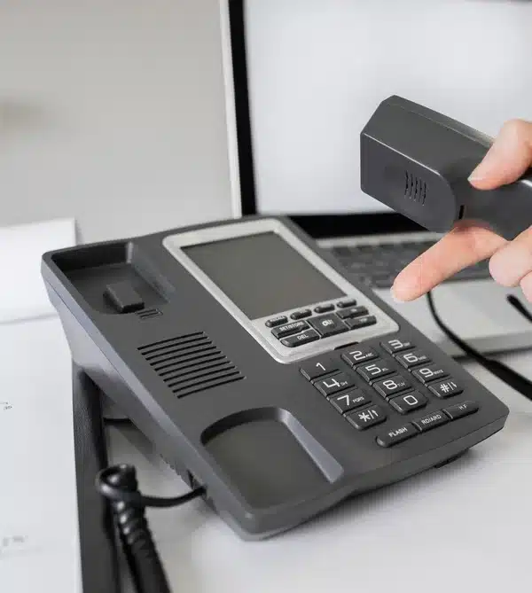 Person dialing a hotline number